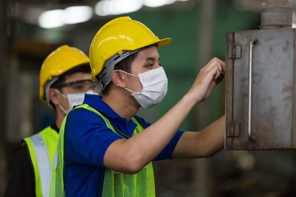 Group,Of,Asian,Male,Worker,Wearing,Face,Mask,Working,At