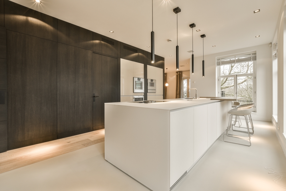 A,Modern,Kitchen,With,White,Counters,And,Dark,Wood,Cabinets