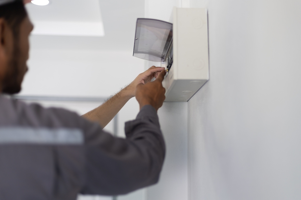 Two,Electricians,Are,Repairing,Electricity,In,A,House.