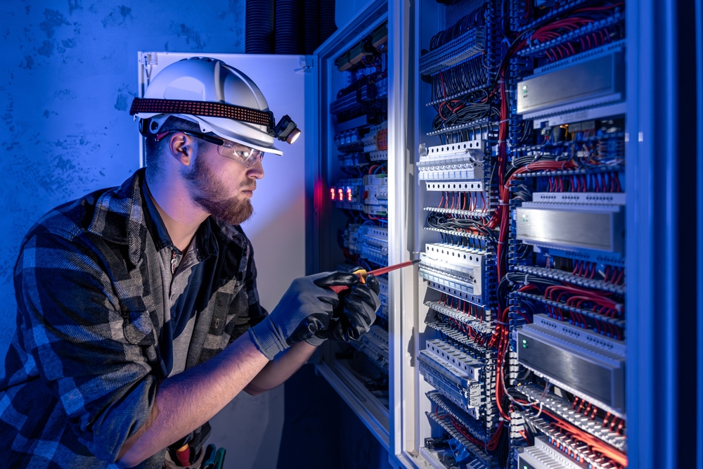 A,Male,Electrician,Works,In,A,Switchboard,In,Overalls,Against