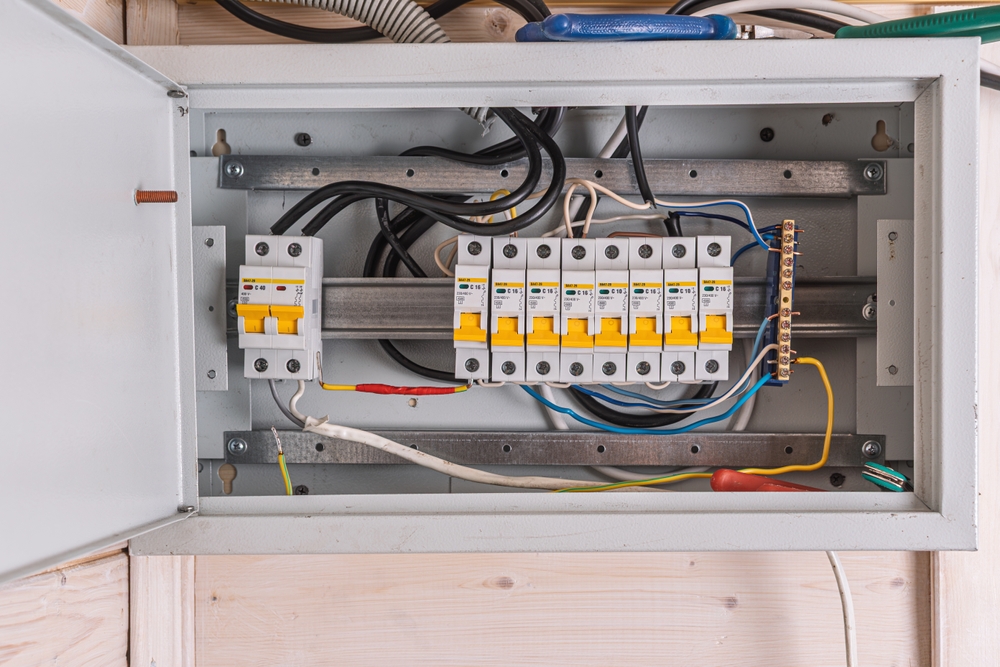 Open,Electrical,Panel,With,Neatly,Arranged,Circuit,Breakers,And,Colorful