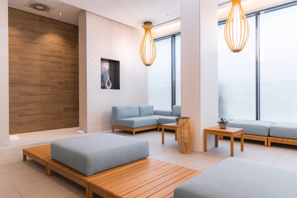 Serene,Spa,Interior,Featuring,Light,Wood,Furniture,,Soft,Blue,Cushions,