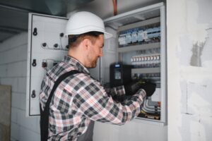 electrician working on panel